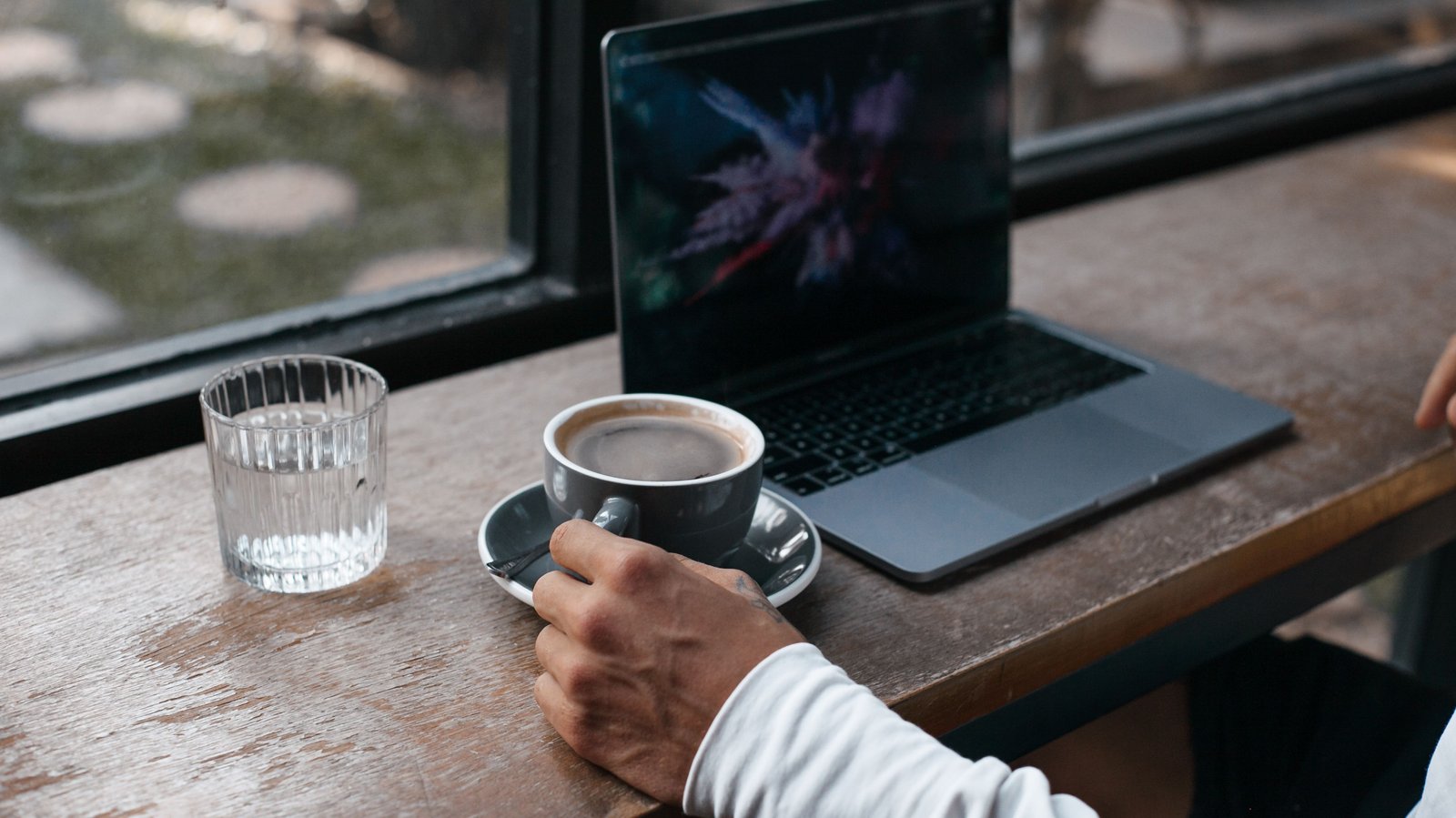 A morning coffee beside a laptop
